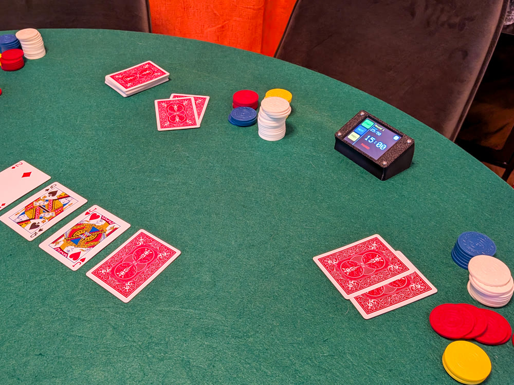 Poker Timer on a live poker table with cards and chips